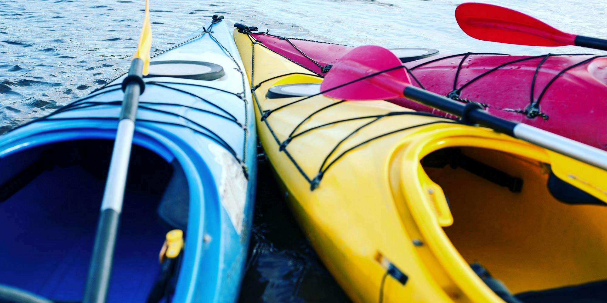 What is a touring kayak and where can you paddle one?